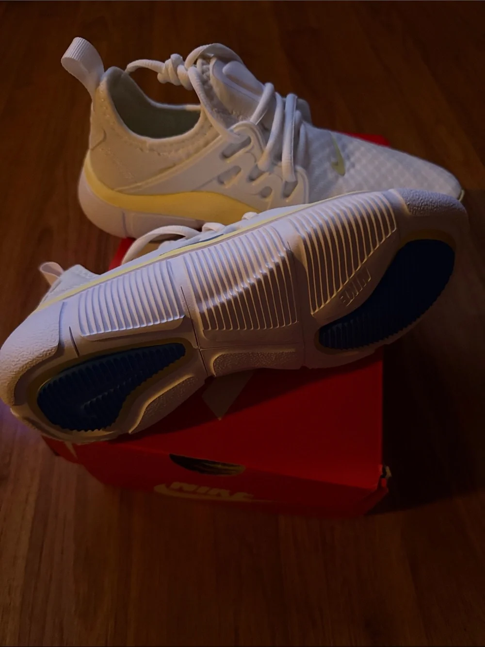Nike White Athletic Sneakers with Blue Swoosh and Cream Trim
